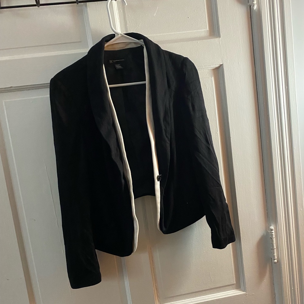 Black blazer with white inner trim